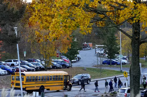 High School students return to school for the first time since the shootings that claimed 18 lives in their community, Tuesday, Oct. 31, 2023, in Lewiston, Maine. (AP Photo/Matt York)