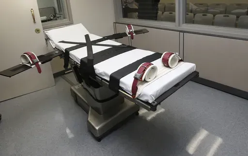This Oct. 9, 2014, file photo shows the gurney in the the execution chamber at the Oklahoma State Penitentiary in McAlester, Okla. (AP Photo/Sue Ogrocki, File)
