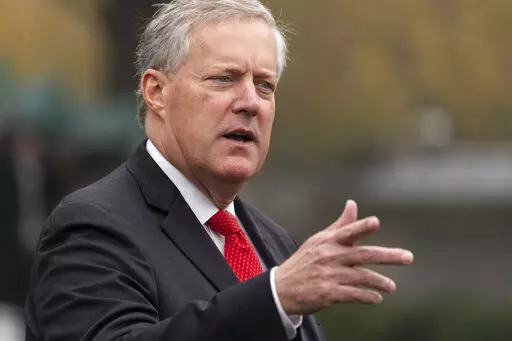 Then-White House chief of staff Mark Meadows speaks with reporters at the White House, Oct. 21, 2020, in Washington. The prosecutor who's investigating whether Donald Trump and his allies illegally tried to influence the 2020 election in Georgia is seeking to compel testimony from more allies of the former president, including Meadows and lawyer Sidney Powell. (AP Photo/Alex Brandon)