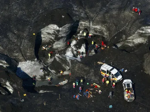 Rescue teams work at the scene after an ice cave partially collapsed, at the Breidamerkurjokull glacier, in southeastern Iceland, Monday, Aug, 26, 2024. (STOD2/ Vilhelm Gunnarsson via AP)