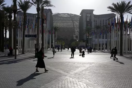 People walk through the venue at the COP28 U.N. Climate Summit near the Al Wasl Dome at Expo City, Thursday, Nov. 30, 2023, in Dubai, United Arab Emirates. (AP Photo/Rafiq Maqbool, File)