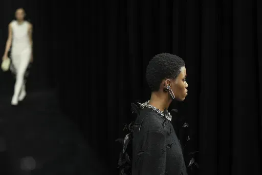 A model wears a creation of the Jil Sander Fall/Winter 2025-2026 women's collection presented in Milan, Italy, Wednesday, Feb. 26, 2025. (AP Photo/Antonio Calanni)