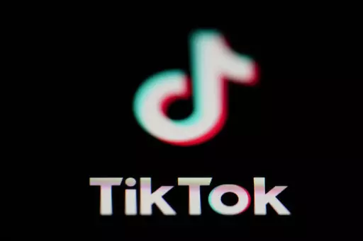 The icon for the video sharing TikTok app is seen on a smartphone, on Feb. 28, 2023. China accused the United States on Thursday, March 16, of spreading disinformation and suppressing TikTok following reports that the Biden administration was calling for its Chinese owners to sell their stakes in the popular video-sharing app. (AP Photo/Matt Slocum, File)