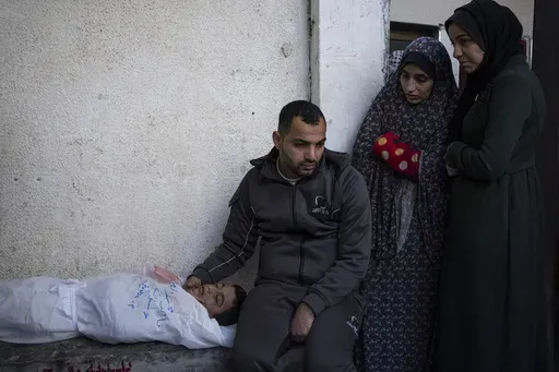 Palestinians mourn a child killed in the Israeli bombardment of the Gaza Strip at a hospital morgue in Rafah, Monday, Feb. 12, 2024. (AP Photo/Fatima Shbair, File)