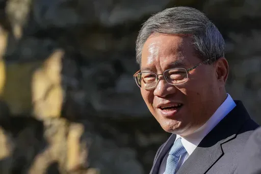 Chinese Premier Li Qiang reacts during a visit to Adelaide Zoo, Australia, Sunday, June 16, 2024. Li is on a relations-mending mission with panda diplomacy, rock lobsters and China's global dominance in the critical minerals sector high on the agenda during his four day visit to Australia. (Asanka Brendon Ratnayake/Pool Photo via AP)