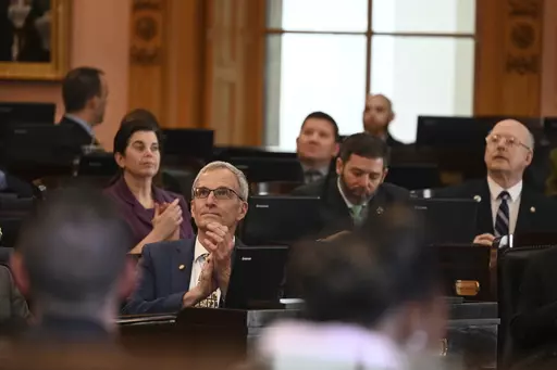 This image provided by the Ohio House Republican Caucus shows Rep. Dave Dobos, a Columbus-area Republican, sitting in the House chamber at the Ohio Statehouse in Columbus, Ohio on March 1, 2023. Dobos is under fire for falsely claiming for decades that he graduated from the Massachusetts Institute of Technology and has since stepped down from a House committee leadership post following the revelation. (Ohio House Republican Caucus via AP)