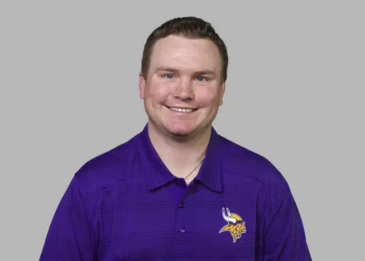 THIS SUBSTITUTES FOR NY156 - FILE - This is a 2014 photo of Adam Zimmer of the Minnesota Vikings NFL football team. Former Minnesota co-defensive coordinator Adam Zimmer, an NFL assistant for 17 years and the son of previous Vikings head coach Mike Zimmer, has died. He was 38. Corri Zimmer White, his younger sister, confirmed the death on her Instagram account on Tuesday. Adam Zimmer died on Monday, Oct. 31, 2022, she said. (AP Photo/File)