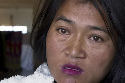 CORRECTS PLACE- A Kuki tribal woman Phalneivah Khonsai, 35, talks to Associated Press in a relief camp in Kangpokpi, Manipur, Monday, Dec. 16, 2024. Khonsai ran for her life when violence struck her neighbourhood in India's restive northeast, carrying just the bare essentials in the hope that her family would return soon. Khonsai, her husband and three children left behind their house, which was torched by a mob, and made for the hills where thousands of people from their community were heading 