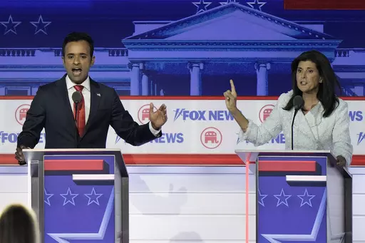 Businessman Vivek Ramaswamy, left, and former U.N. Ambassador Nikki Haley speak during a Republican presidential primary debate hosted by FOX News Channel, Aug. 23, 2023, in Milwaukee. Ramaswamy and Haley, two of the leading contenders for the Republican presidential nomination, are Indian Americans, even though polling points to an Indian diaspora that overwhelmingly votes Democrat. The two candidates are running significantly behind former President Donald Trump and also trail Florida Gov. Ron