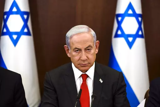 Israeli Prime Minister Benjamin Netanyahu convenes a weekly cabinet meeting at the Prime Minister's office in Jerusalem, Sunday, Jan. 8, 2023. (Ronen Zvulun/Pool Photo via AP)