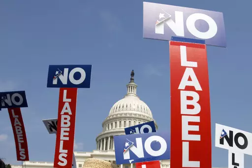 People with the group No Labels hold signs during a rally on Capitol Hill in Washington, July 18, 2011. More than 15,000 people in Arizona have registered to join a new political party floating a possible bipartisan “unity ticket” against Joe Biden and Donald Trump. (AP Photo/Jacquelyn Martin, File)