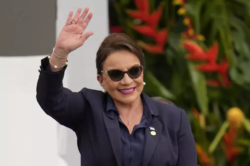 Honduras' President Xiomara Castro waves during the swearing-in ceremony for Colombia's President Gustavo Petro in Bogota, Colombia, Sunday, Aug. 7, 2022. Castro announced on Tuesday, March 14, 2023, that Honduras under her administration is opening diplomatic relations with the People´s Republic of China. (AP Photo/Fernando Vergara, File)