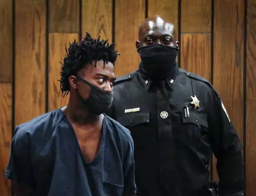Ezekeil Kelly, left makes his first court appearance on Friday, Sept. 9, 2022 in Memphis, Tenn. Kelly is  accused of killing four people and wounding three others in a livestreamed shooting rampage that paralyzed Memphis and led to a city-wide manhunt.  (Mark Weber/Daily Memphian via AP)