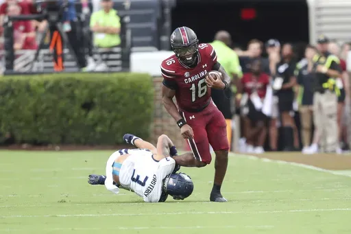 Old Dominion safety Mario Easterly (3) tackles South Carolina quarterback LaNorris Sellers (16) during the first half of an NCAA college football game Saturday, Aug. 31, 2024, in Columbia, S.C. (AP Photo/Artie Walker Jr.)