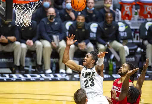 Purdue guard Jaden Ivey (23) watches as his shot heads toward the basket after his drive into the lane during the second half of the team's NCAA college basketball game against Nicholls State, Wednesday, Dec. 29, 2021, in West Lafayette, Ind. (AP Photo/Doug McSchooler)