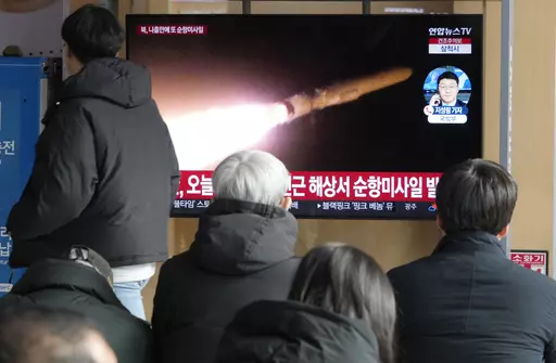 A TV screen shows a file image of North Korea's missile launch during a news program at the Seoul Railway Station in Seoul, South Korea, Sunday, Jan. 28, 2024. South Korea's military said Sunday that North Korea fired several cruise missiles that flew over waters near a major military shipyard on the country's eastern coast, extending a streak in weapons tests that are worsening tensions with the United States, South Korea and Japan. (AP Photo/Ahn Young-joon)