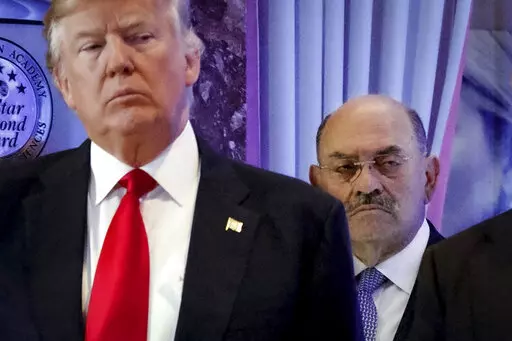 Allen Weisselberg, right, stands behind then President-elect Donald Trump during a news conference in the lobby of Trump Tower in New York, Jan. 11, 2017. Weisselberg, Trump's chief financial officer, is expected to plead guilty on Thursday, Aug. 18, 2022 to tax violations in a deal that would require him to testify about business practices at the former president's company. (AP Photo/Evan Vucci, File)