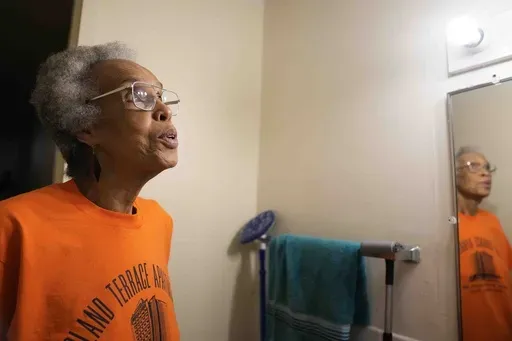 Bernadine Gibson, 82, talks about ventilation issues in her bathroom and how she is looking forward to renovations to the building her family has lived in for 27 years, Monday, Nov. 18, 2024, in Chicago. (AP Photo/Erin Hooley)