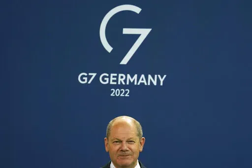German Chancellor Olaf Scholz attends the presentation of a special stamp of the German mail service Deutsche Post for the upcoming G7 summit, at the chancellery in Berlin, Germany, Wednesday, June 15, 2022. Three back-to-back summits over the next week will test Western resolve to support Ukraine and the extent of international unity as rising geopolitical tensions and economic pain cast an increasingly long shadow. (AP Photo/Markus Schreiber, File)