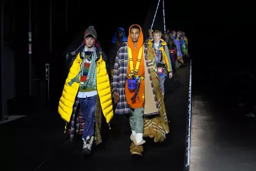 Models wear creations for the DSquared2 fall winter 22/23 collection, in Milan, Italy, Friday, Jan. 14, 2022. (AP Photo/Luca Bruno)