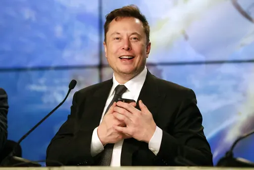Elon Musk founder, CEO, and chief engineer/designer of SpaceX speaks during a news conference after a Falcon 9 SpaceX rocket test flight at the Kennedy Space Center in Cape Canaveral, Fla, Jan. 19, 2020. Musk won't be joining Twitter's board of directors as previously announced. The tempestuous billionaire remains Twitter’s largest shareholder. (AP Photo/John Raoux, File)
