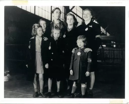 In this May 26, 1946, photo, Ginger Lane, bottom right, and her siblings arrive in New York City as Holocaust survivors who were hidden in a fruit orchard near Berlin by non-Jews. Their mother was killed at the death camp at Auschwitz. Lane has since made it her lifelong mission to educate others of this painful past. (Courtesy Ginger Lane via AP)