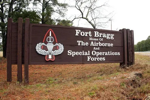 This Jan. 4, 2020 file photo shows a sign for at Fort Bragg, N.C. An independent commission is recommending that the Confederate Memorial at Arlington National Cemetery be dismantled and taken down, as part of its final report to Congress on the renaming of military bases and assets that commemorate the Confederacy. Panel members on Tuesday rolled out the final list of ships, base roads, nine U.S. Army bases including Fort Bragg, buildings and other items that they said should be renamed. (AP Ph