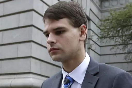 Nathan Carman leaves federal court in Providence, R.I., Aug. 21, 2019. An autopsy has determined that Carman's death while he was awaiting trial on charges of killing his mother off the coast of New England in a scheme to inherit millions of dollars was not suspicious, the New Hampshire attorney general's office said Wednesday, June 28, 2023. Twenty-nine-year-old Carman was found dead in his cell in a county jail in New Hampshire on June 15. (AP Photo/Steven Senne, File)