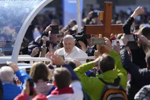 Pope Francis arrives for a mass in Kossuth Lajos' Square in Budapest, Hungary, Sunday, April 30, 2023. (AP Photo/Darko Vojinovic)