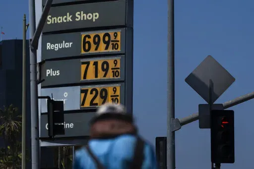High gas prices are shown in Los Angeles, Tuesday, May 24, 2022. To drive, or not to drive? This Memorial Day weekend, with surging gas prices that are redefining pain at the pump, that is the question for many Americans as a new COVID-19 surge also spreads across the country.   (AP Photo/Jae C. Hong)