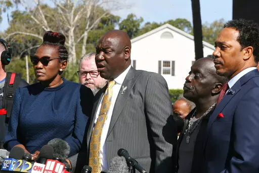 Attorney Benjamin Crump speaks to the media Tuesday, Feb. 22, 2022 outside the federal courthouse in Brunswick, Ga. The three men convicted of murder in Ahmaud Arbery’s fatal shooting have been found guilty of federal hate crimes. A jury delivered its verdict Tuesday after several hours of deliberations. (AP Photo/Lewis Levine)