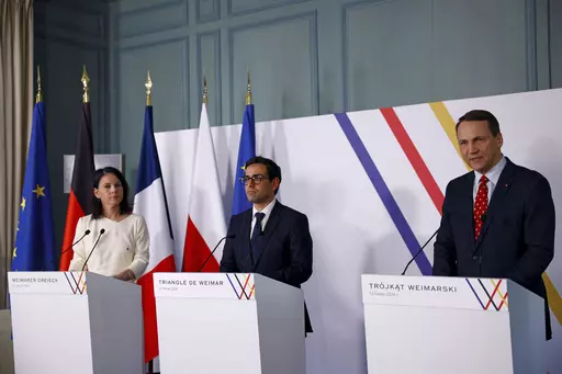 French Foreign and European Affairs Minister Stephane Sejourne, center, German Foreign Minister Annalena Baerbock, left, and Polish Foreign Minister Radoslaw Sikorski attend a press conference after the Weimar Triangle talks at the Chateau de La Celle Saint-Cloud near Paris, Monday, Feb. 12, 2024. The foreign ministers of France, Germany and Poland met on Monday as they seek to revive the so-called Weimar Triangle, a political format that has been dormant for years. The Weimar Triangle was creat