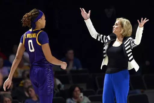 LSU head coach Kim Mulkey, right, talks with forward LaDazhia Williams (0) during the second half of an NCAA college basketball game against Vanderbilt, Thursday, Feb. 23, 2023, in Nashville, Tenn. (AP Photo/Mark Zaleski)