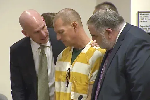 Lawyers console paramedic Peter Cichuniec after his sentence is read, March 1, 2024, in Brighton, Colo. (Colorado State Court via AP, Pool, File)