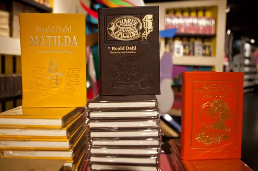 Books by Roald Dahl are displayed at the Barney's store on East 60th Street in New York on Monday, Nov. 21, 2011. Critics are accusing the publisher of Roald Dahl’s classic children’s books of censorship after it removed colorful language from stories such as “Charlie and the Chocolate Factory” and “Matilda” to make them more acceptable to modern readers. (AP Photo/Andrew Burton, File)