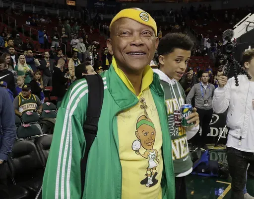 Former Seattle SuperSonics player Slick Watts stands courtside before an NBA basketball game on Friday, Oct. 5, 2018, in Seattle. (AP Photo/Ted S. Warren,File)