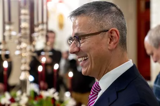 White House social secretary Carlos Elizondo speaks to members of the media during a media preview for the State Dinner with President Joe Biden and French President Emmanuel Macron in the State Dining Room of the White House in Washington, Nov. 30, 2022. (AP Photo/Andrew Harnik, File)