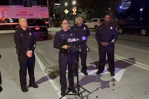 Assistant Police Chief Nicole J. Waldner holds a news conference early Saturday, Sept. 3, 2022 following a fatal shooting downtown Milwaukee.  A man was killed by Milwaukee officers after he led them on a chase into a busy downtown bar district, then got out of his vehicle and opened fire on them, police said.  One bystander was hit by gunfire in the Friday night shootout, police said. (Drake Bentley/Milwaukee Journal-Sentinel via AP)