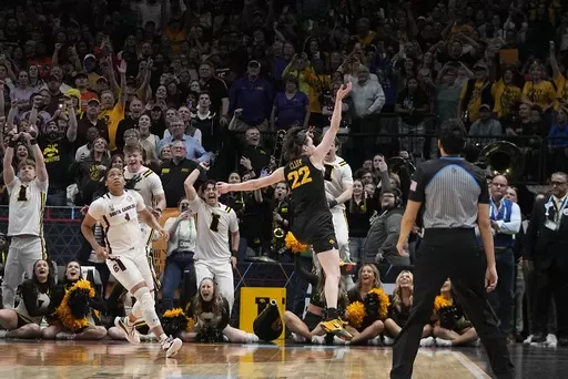 Iowa's Caitlin Clark reacts after an NCAA Women's Final Four semifinals basketball game against South CarolinaFriday, March 31, 2023, in Dallas. Iowa won 77-73 to advance to the championship on Sunday. (AP Photo/Darron Cummings)