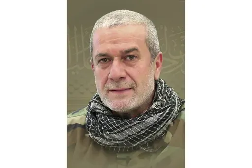 This picture released by Hezbollah media relations office, shows a portrait of Hezbollah commander Mohammad Naameh Nasser, who was killed by an Israeli airstrike that hit his car, in the southern costal town of Tyre, Lebanon, Wednesday, July 3, 2024. The strike took place as global diplomatic efforts have intensified in recent weeks to prevent escalating clashes between Hezbollah and the Israeli military from spiralling into an all-out war that could possibly lead to a direct confrontation betwe