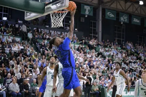 Memphis forward Dain Dainja (42) shoots against Tulane during the first half of an NCAA college basketball game in New Orleans, Thursday, Jan. 30, 2025. (AP Photo/Matthew Hinton)