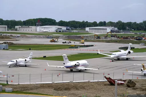 Planes sit on the tarmac at the Des Moines International Airport, Monday, June 13, 2022, in Des Moines, Iowa. With an eye on the upcoming July Fourth weekend, airlines are stepping up their criticism of federal officials over recent widespread flight delays and cancellations. The industry trade group Airlines for America said Friday, June 24, 2022, that understaffing at the Federal Aviation Administration is crippling traffic along the East Coast. (AP Photo/Charlie Neibergall, File)