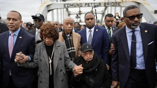 U.S. Rep. Hakeem Jeffries, D-NY, U.S. Rep. Maxine Waters, D-Calif., Rev. Al Sharpton, Rev. Jesse Jackson and NAACP President Derick Johnson, from left, march across the Edmund Pettus bridge during the 60th anniversary of the march to ensure that African Americans could exercise their constitutional right to vote, Sunday, March 9, 2025, in Selma, Ala. (AP Photo/Mike Stewart)