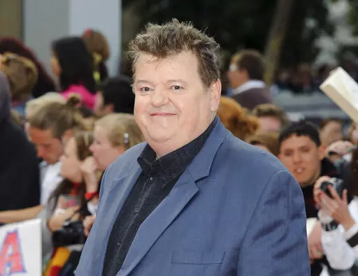 Robbie Coltrane arrives in Trafalgar Square, central London, for the world premiere of "Harry Potter and The Deathly Hallows: Part 2," the last film in the series on July 7, 2011. Coltrane, who played a forensic psychologist on TV series “Cracker” and Hagrid in the “Harry Potter” movies, has died. Coltrane’s agent Belinda Wright said he died Friday at a hospital in Scotland. He was 72. (AP Photo/Jonathan Short, File)