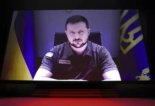 President of Ukraine Volodymyr Zelenskyy appears via remote during the opening ceremony of the 75th international film festival, Cannes, southern France, Tuesday, May 17, 2022. (Photo by Vianney Le Caer/Invision/AP)