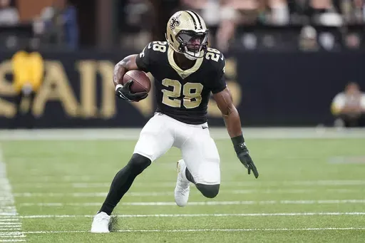 New Orleans Saints running back David Johnson runs during the first half an NFL football game against the Carolina Panthers in New Orleans, Jan. 8, 2023. Johnson says he's retiring from the NFL after eight seasons. The 32-year-old made the announcement on Instagram Sunday, May 19, 2024. (AP Photo/Gerald Herbert, File)