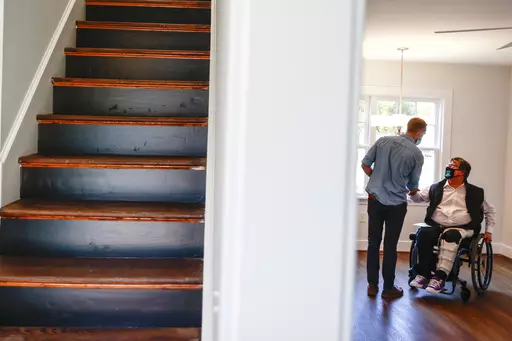 BoundaryLess Living founder and CEO William Sweeney, chats with an attendee on Nov. 17, 2021 at a BoundaryLess Living adaptive living home in Richmond, Va. Roughly 1.8 million businesses in the U.S. are owned by someone with a disability, according to the American Community Survey conducted by the U.S. Census Bureau. And while the path to entrepreneurship is rarely easy, business owners with disabilities often need to overcome additional challenges, like societal misconceptions, barriers to fina