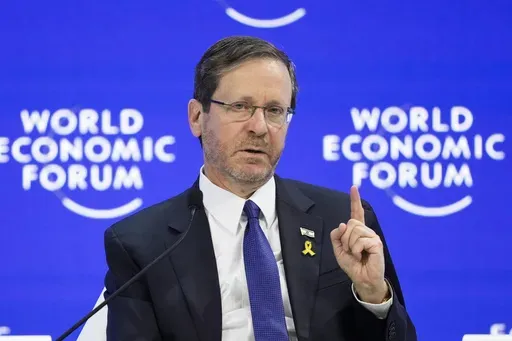 Israel's President Isaac Herzog speaks at the World Economic Forum in Davos, Switzerland, Jan. 18, 2024. Israel's president on Sunday Jan. 28, 2024 accused the U.N. world court of misrepresenting his words in a ruling that ordered Israel to take steps to protect Palestinians and prevent a genocide in the Gaza Strip. (AP Photo/Markus Schreiber, File)
