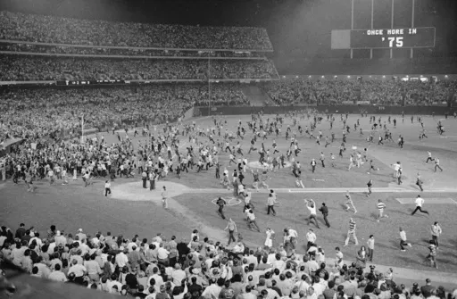 Fans pour onto the field at the Oakland Coliseum after the Oakland A's beat the Los Angeles Dodgers 3-2 and won their third straight World Series, Oct. 17, 1974, in Oakland. (AP Photo, File)