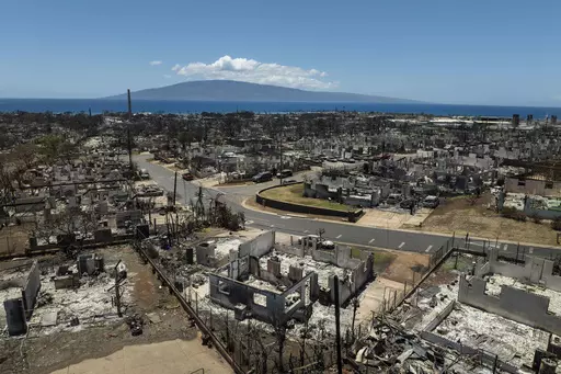 The aftermath of a devastating wildfire is seen, Aug. 22, 2023, in Lahaina, Hawaii. Americans nationwide face hefty increases in their homeowner’s insurance premiums in the coming years, a report by the First Street Foundation said on Wednesday, Sept. 20, as climate change intensifies floods, wildfires and storms in ways insurance companies are simply unable to keep up with. (AP Photo/Jae C. Hong, File)